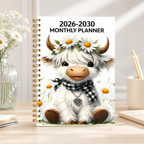 A monthly planner cover featuring a cute white goat with horns and a floral wreath, designed for 2026-2030 planning.