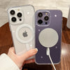 A hand holds a clear magnetic transparent phone case with an Apple logo and a silver circular accessory on the back.