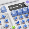 Close-up of a custom mechanical keyboard featuring various colored and shaped keycaps and switches for customization