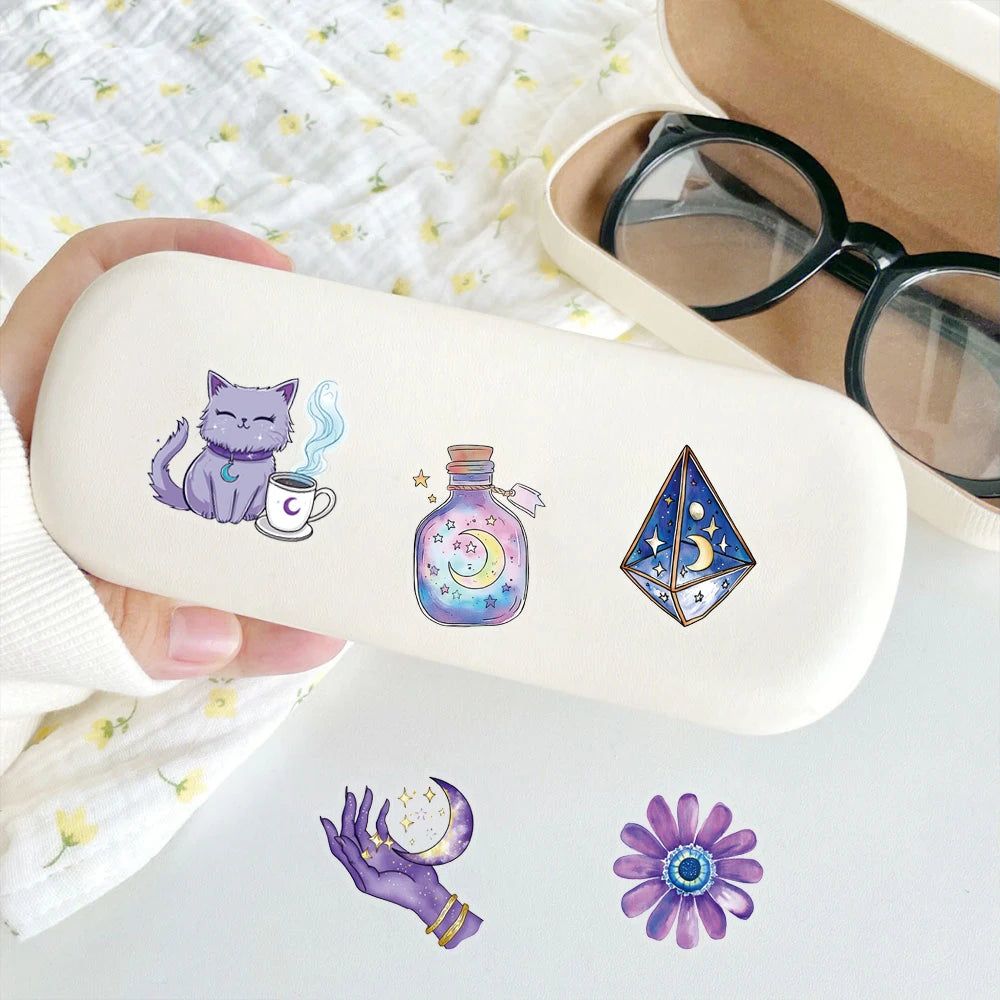 A light beige silicone case featuring purple magic witch stickers, including a cat, a potion bottle, and a geometric crystal.