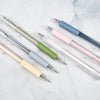 A collection of six precision utility pens or knives in various pastel colors including mint green, light blue, pink, and whi