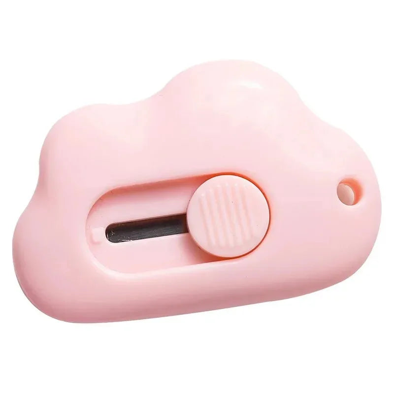 A pink utility knife set shaped like a rabbit cloud with a sliding blade mechanism.