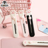 Three pink and white portable pet claw tools or knives are displayed on a pink background.