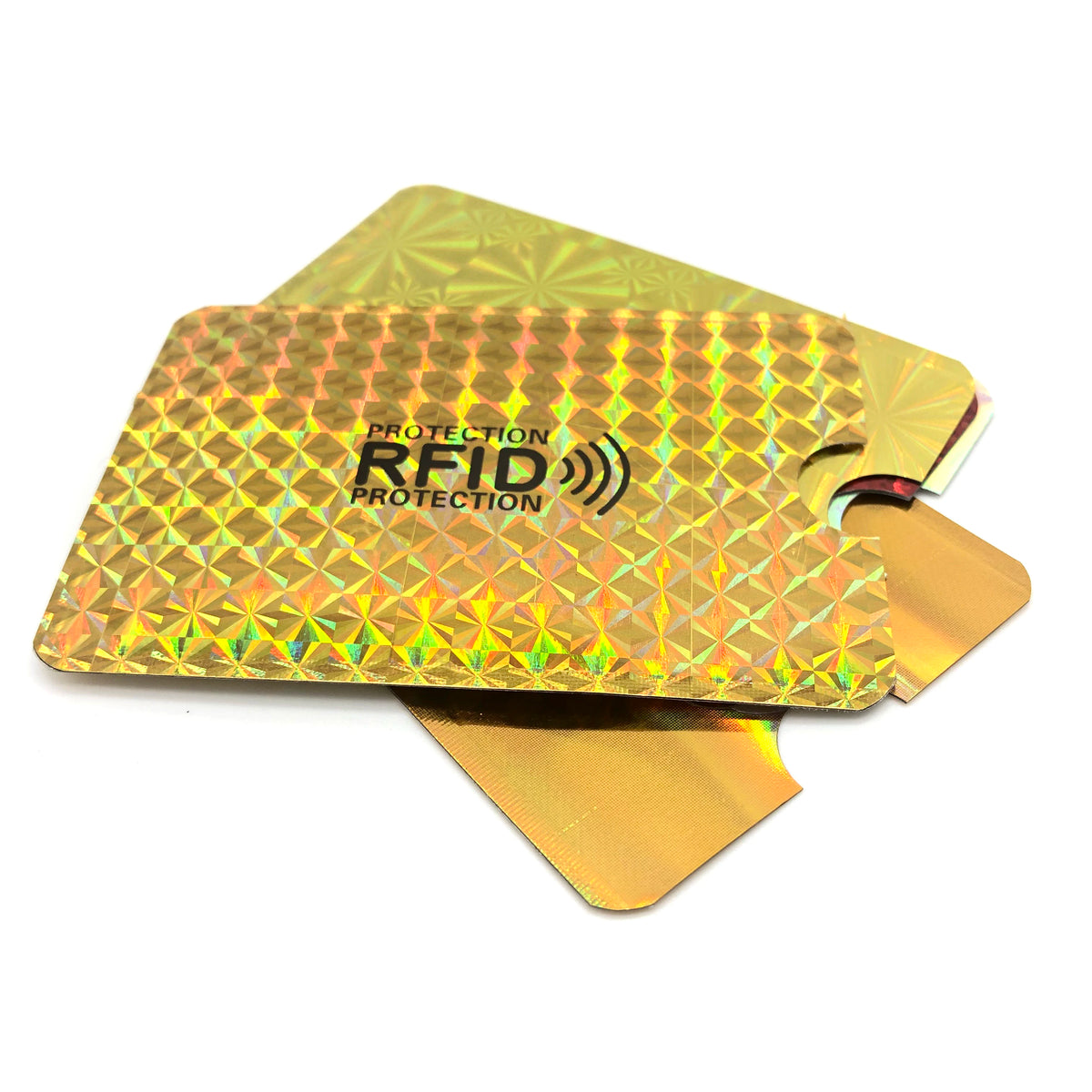 A gold-colored RFID protection card holder with a security warning label.
