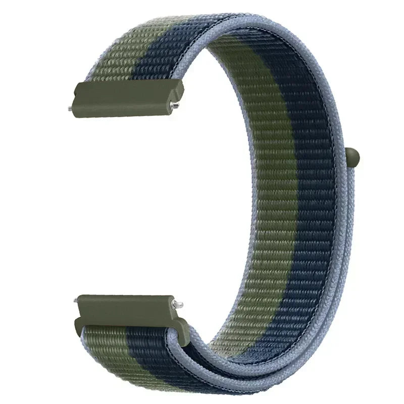 A close-up view of a multi-colored nylon loop watch strap with a green, blue, and gray striped pattern.