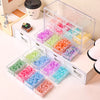Acrylic transparent bead storage box with stackable compartments filled with various colored plastic beads