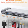 A laptop stand featuring a multi-function USB C Hub with various ports including HDMI, USB-A, and power delivery options.