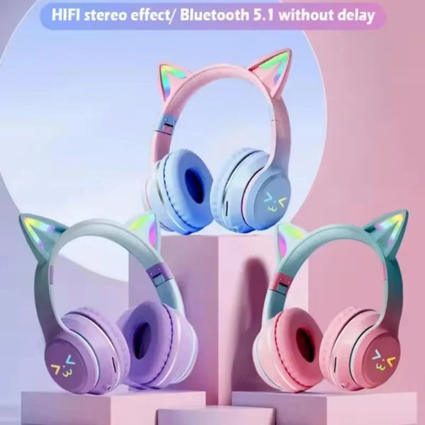 Pink and blue gradient cat ear Bluetooth headphones displayed on a stand.
