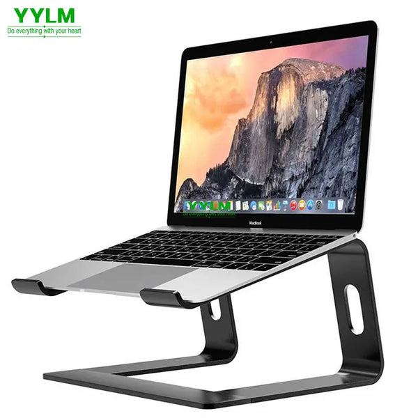 A silver aluminum alloy laptop stand with an ergonomic tilt design supporting a laptop.