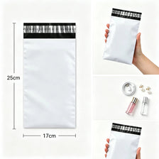 A white self-adhesive courier mailer bag is shown next to a hand, with dimensions marked.
