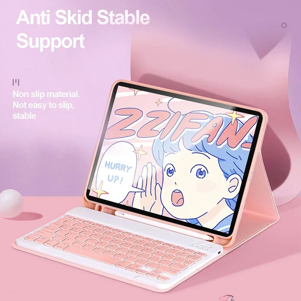 A pink universal keyboard case for an iPad is shown with a laptop keyboard inside, featuring a cartoon design.