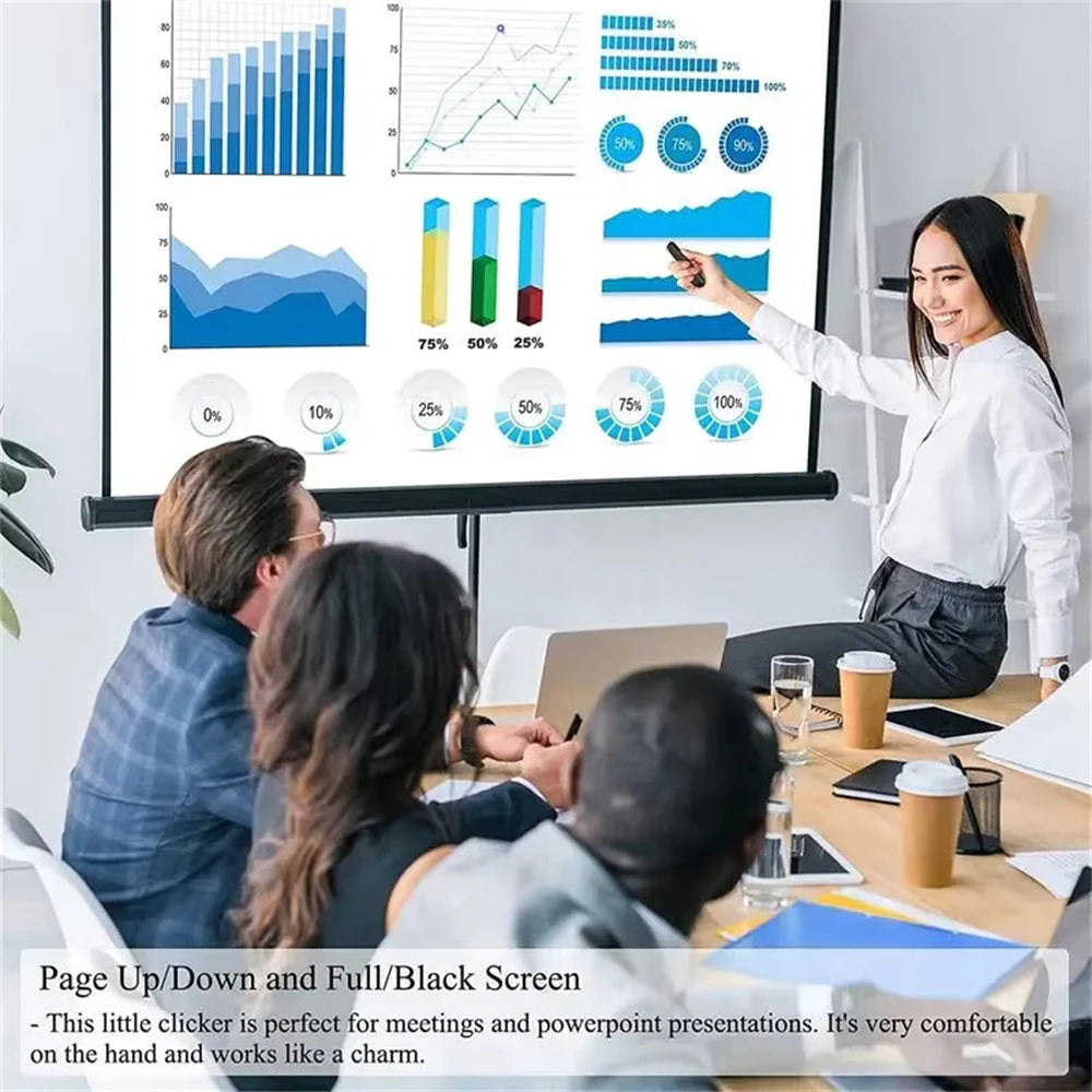 A woman points at a presentation screen displaying charts and graphs while sitting at a table.