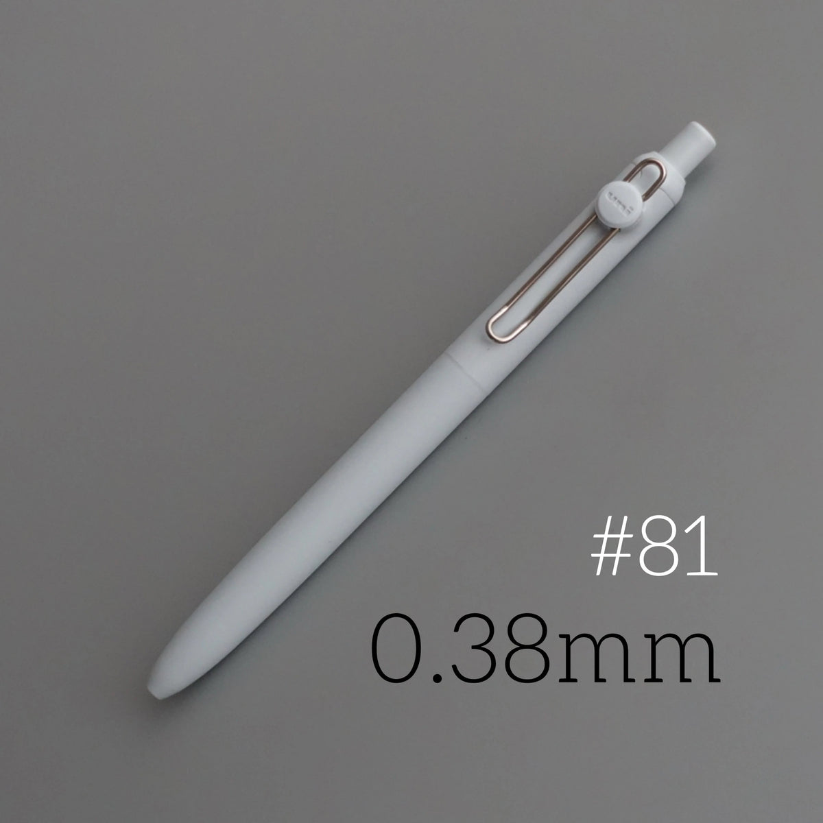 A white precision gel pen with a metallic clip and a 0.38mm tip, shown diagonally on a gray background.