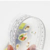 Transparenter PVC-Notizblock-Lesezeichen mit Messmarkierungen und einer Seite mit kleinen Illustrationen.