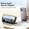 A gray smartphone is shown resting on a black foldable stand, demonstrating its use as a phone stand and adapter.
