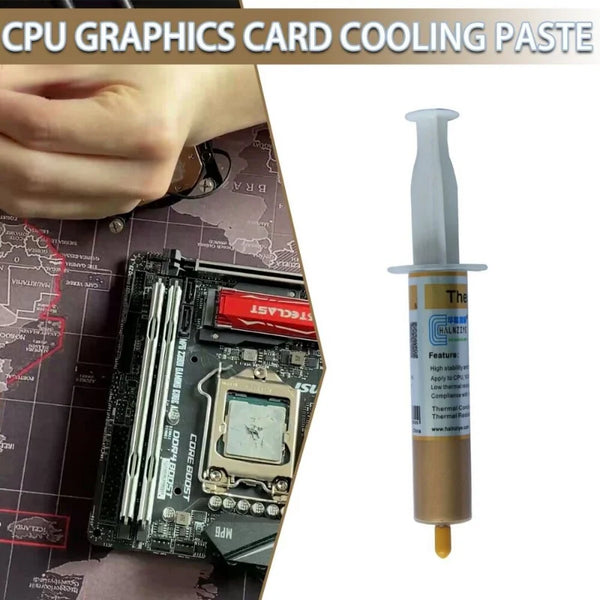 Un tubo de pasta térmica para refrigeración de CPU y tarjeta gráfica junto a una placa base de computadora.