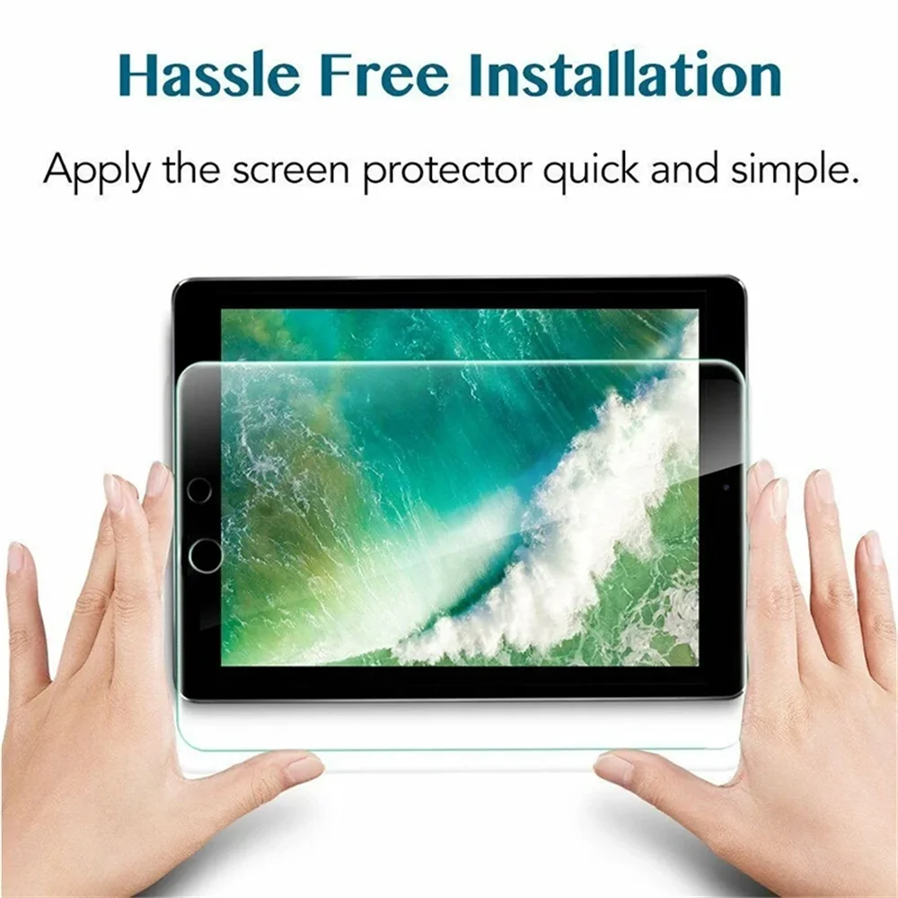 Hands applying a clear tempered glass screen protector to an iPad screen.