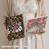 A hand holds a leopard print protective case for an iPad, with the tablet not included.