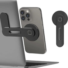 A magnetic phone holder is attached to a laptop, with a smartphone resting on the holder.