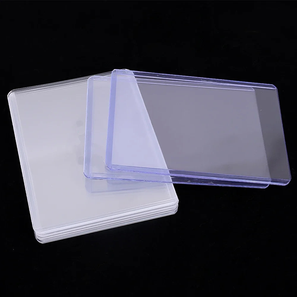 A stack of clear protective card sleeves with anti-scratch film, showing various thicknesses and angles.