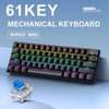 A black wired mini mechanical keyboard is shown on a blue surface, with its components visible.