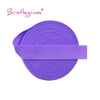 Purple bristleglass elastic hair ties and trims rolled into a band