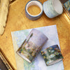 A set of oil painting themed decorative washi tape rolls displayed on a gold tray.