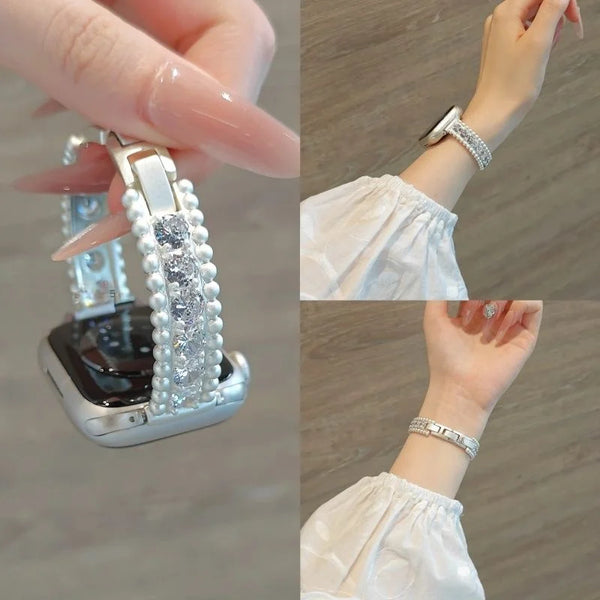 A close-up of a crystal-embellished watch strap with sparkling zircon accents being worn on a wrist.