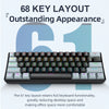 Vue rapprochée d'un clavier mécanique noir 61 touches avec éclairage RGB sur fond gris clair.
