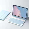 A light blue detachable keyboard folio case for an iPad, showing the screen with a pink bear illustration.