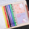 A clear PVC zipper binder with multiple colored pockets for storing cash and small items.