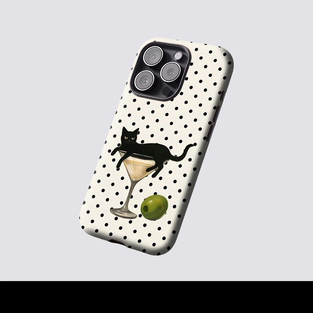A hybrid phone case featuring a black cat and martini glass design on a white background with black polka dots.