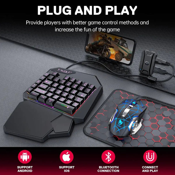 A black T-Wolf plug and play mobile gaming keyboard and mouse combo with a charging cable and a hexagonal mousepad.