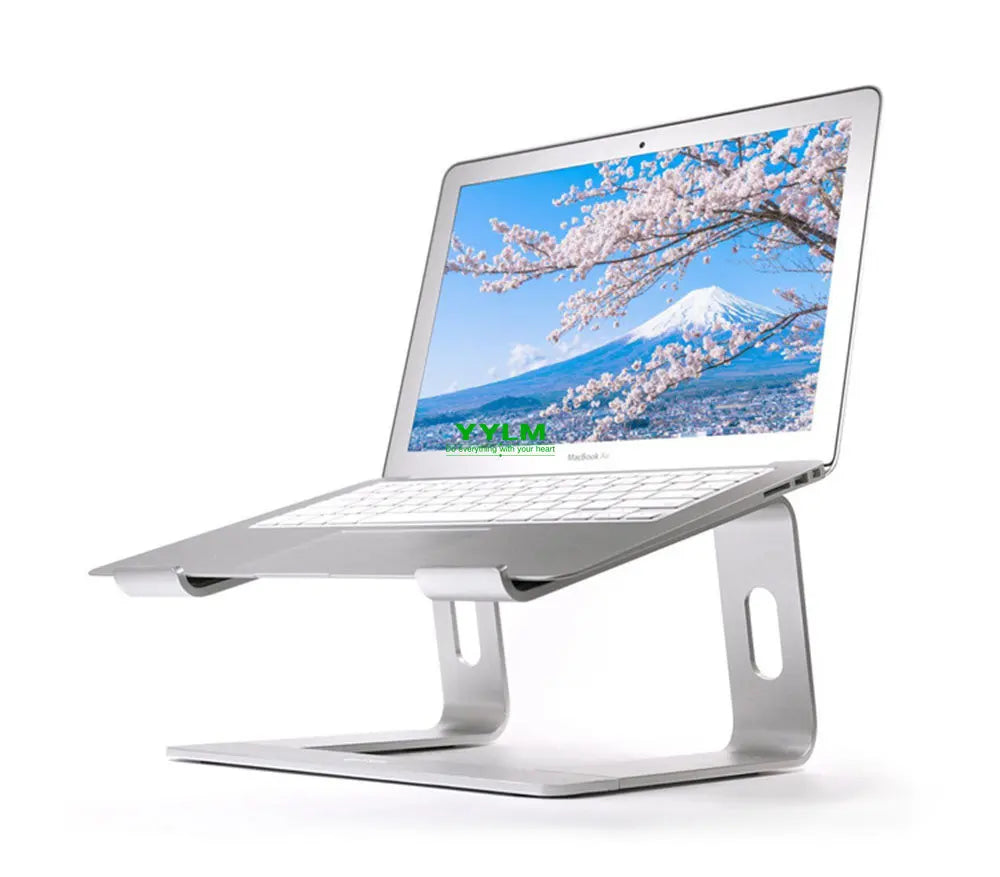 Silver aluminum alloy laptop stand with an open laptop displaying a cherry blossom landscape.