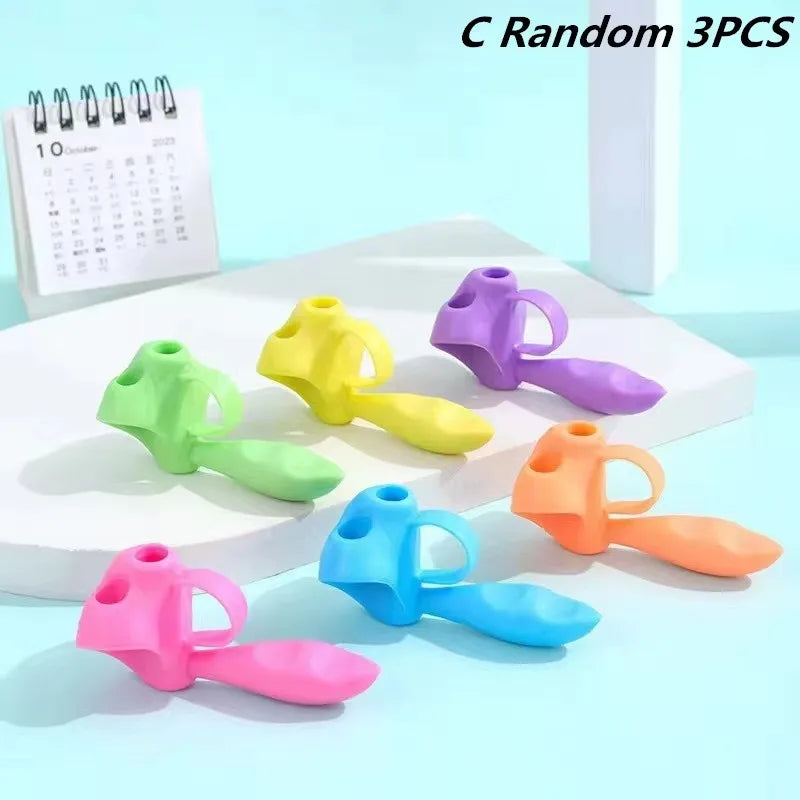 A set of five colorful silicone pencil grips in various shades including yellow, green, purple, orange, and blue.