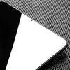 A close-up view of a white iPad screen protected by a perforated privacy tempered glass screen protector.