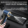 A hand is using a blue and gold multifunctional tool to blow and suck dust from a laptop keyboard.