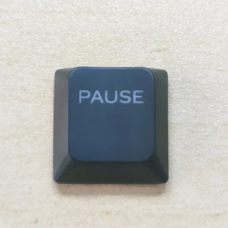 A dark blue keycap labeled PAUSE for a Dell Alienware keyboard.