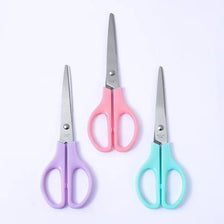 A set of four professional hand scissors in pink, purple, and teal colors for office and craft use.
