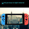A close-up of a Nintendo Switch console with an orange Joy-Con, displaying a city skyline view on the screen.