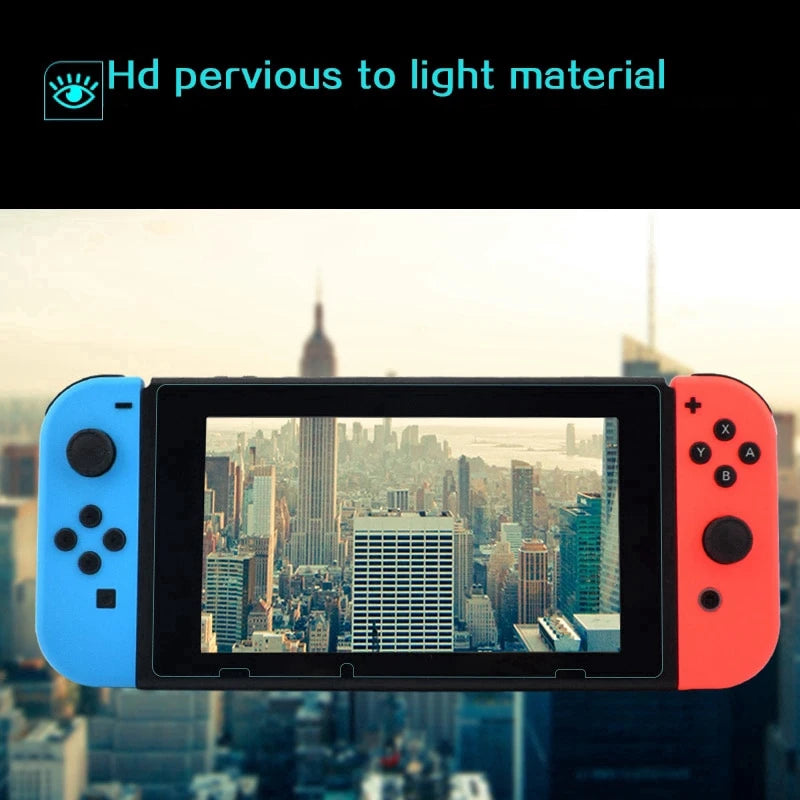 A close-up of a Nintendo Switch console with an orange Joy-Con, displaying a city skyline view on the screen.