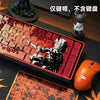 A close-up shot of red and black anime themed PBT keycaps for a mechanical keyboard, displayed next to an orange gaming mouse