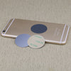 A gold-colored smartphone with magnetic mount plates visible on the back.