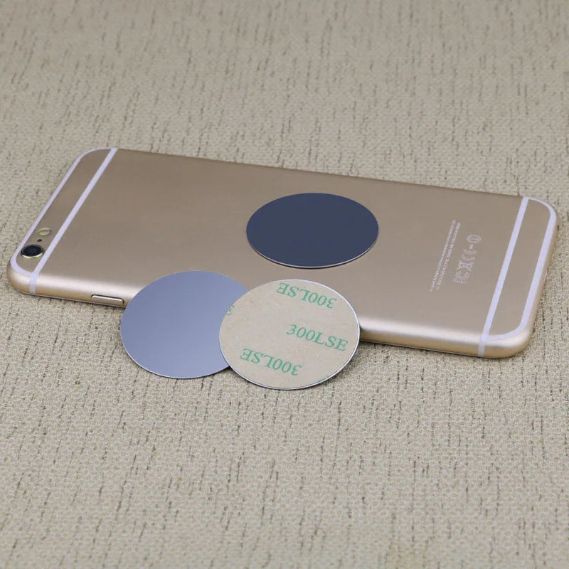 A gold-colored smartphone with magnetic mount plates visible on the back.