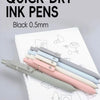 A collection of black 0.5mm quick-dry ink pens lined up on a white sheet of paper.