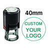 A black self-inking stamp with a clear cylinder, featuring text and a red indicator light.