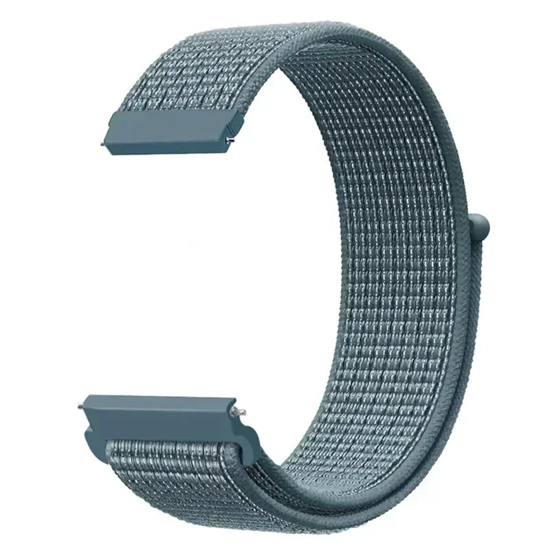 A close-up view of a gray nylon loop watch strap for kids, showing the textured material and buckle area.