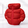 A bright red puffer jacket pen holder with a zipper and quilted texture.