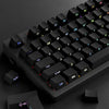 A close-up view of black PBT double-shot cherry profile keycaps on a mechanical keyboard.