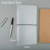 A transparent notebook shell with a brown cover is shown next to a silver pen and dimensions.